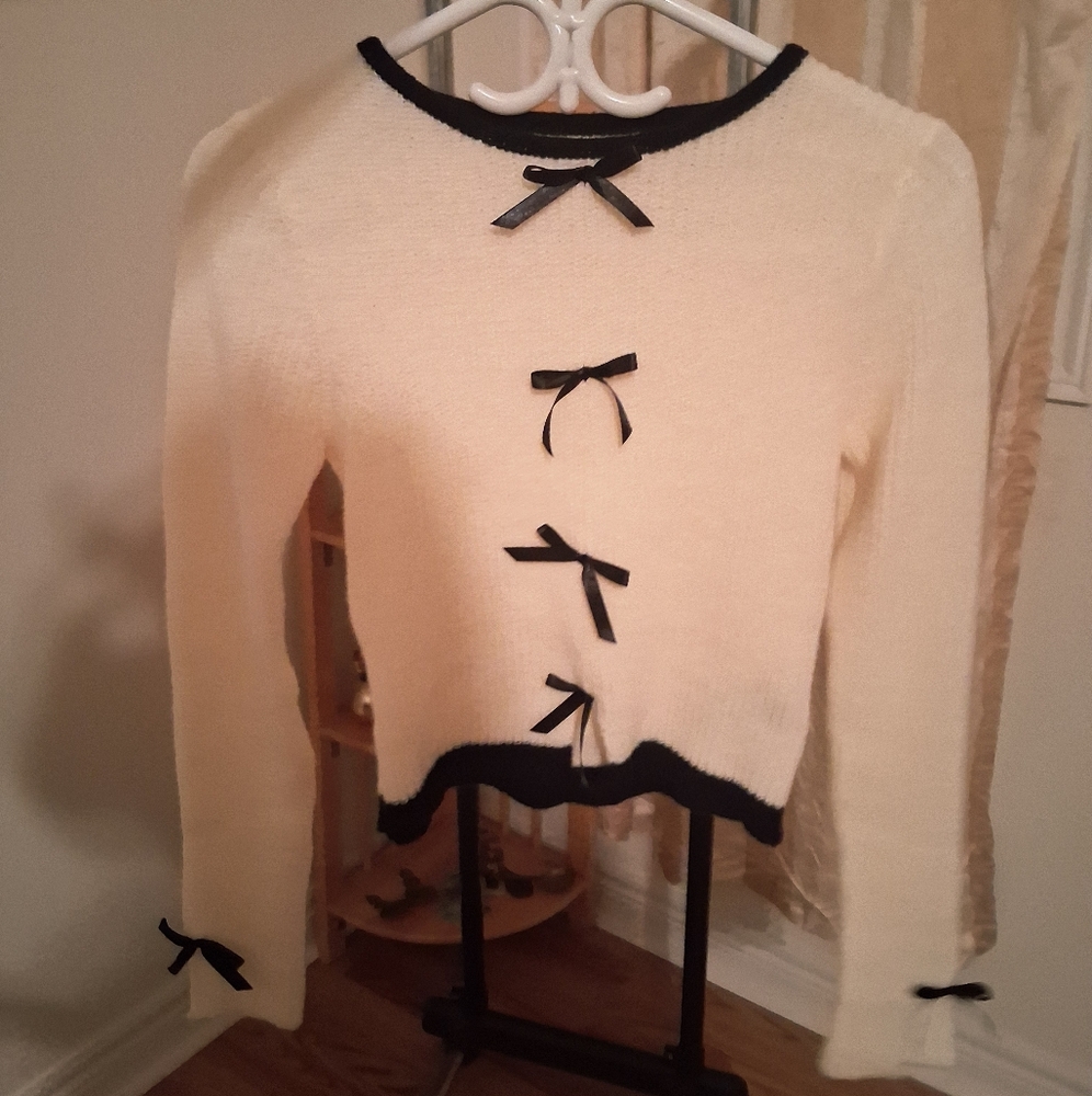 Cream Sweater with Black Bow Accents